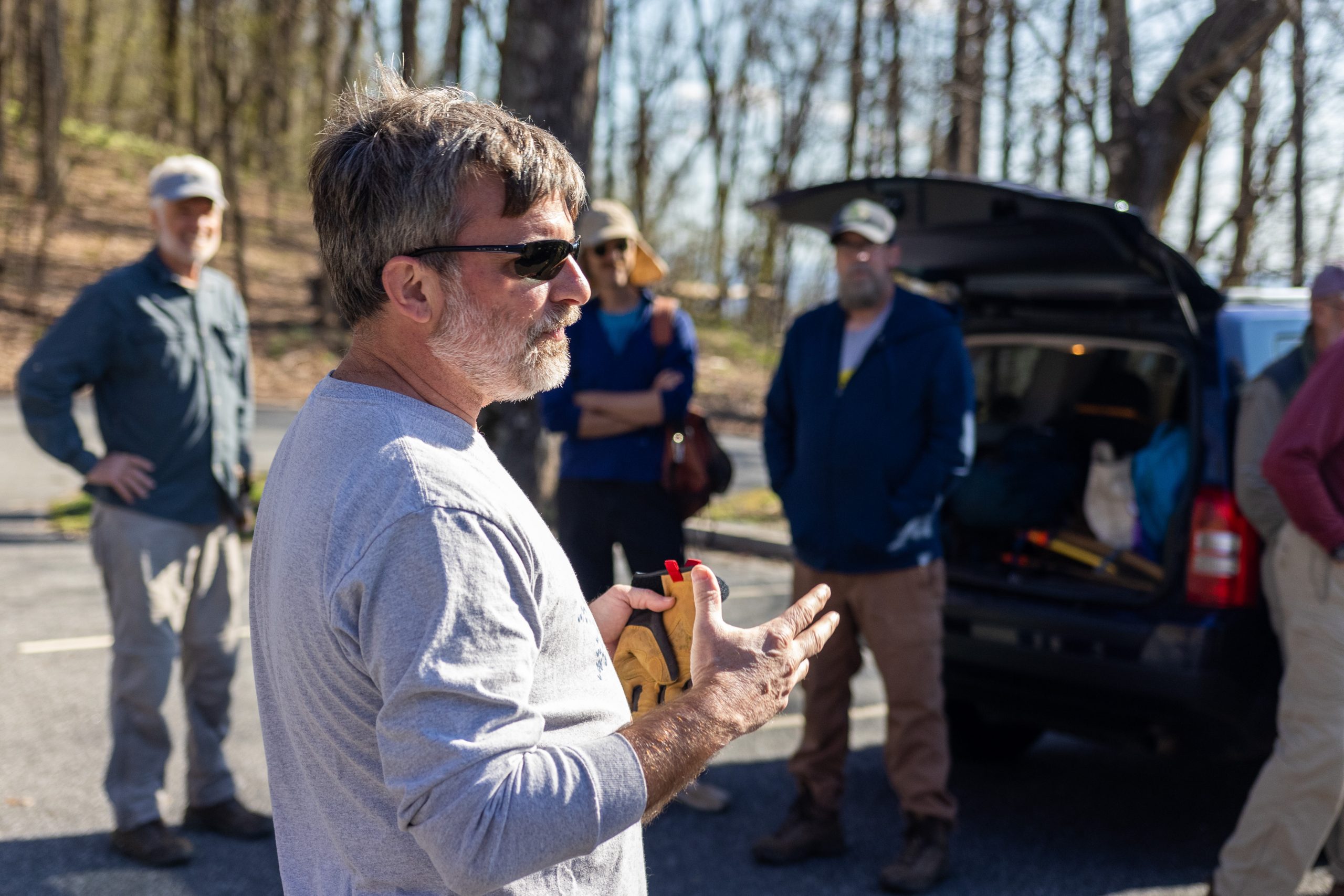 Tim giving instructions to trail-building volunteers