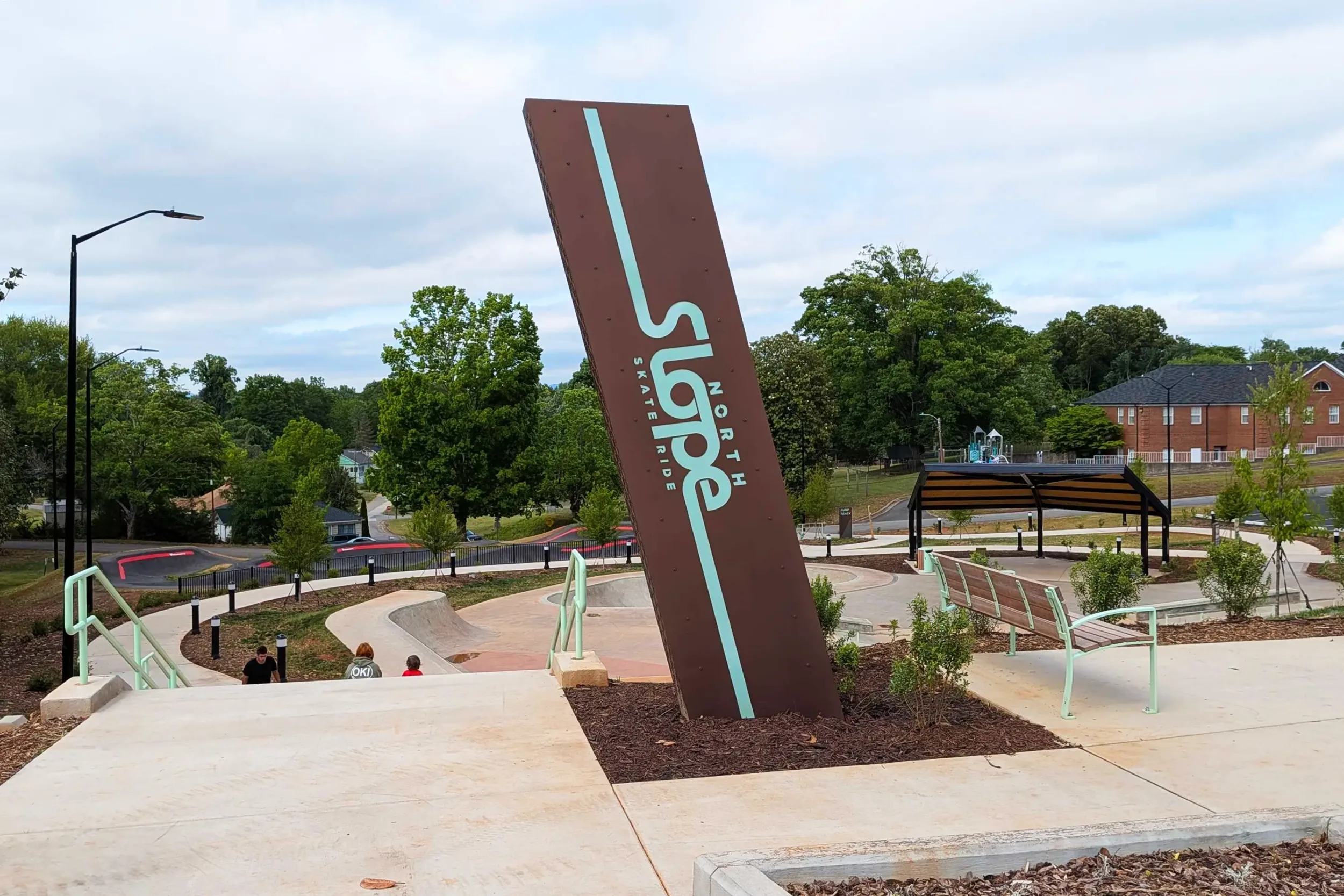 The entrance monument to Spindale Skate Park, with the rest of the park in the background