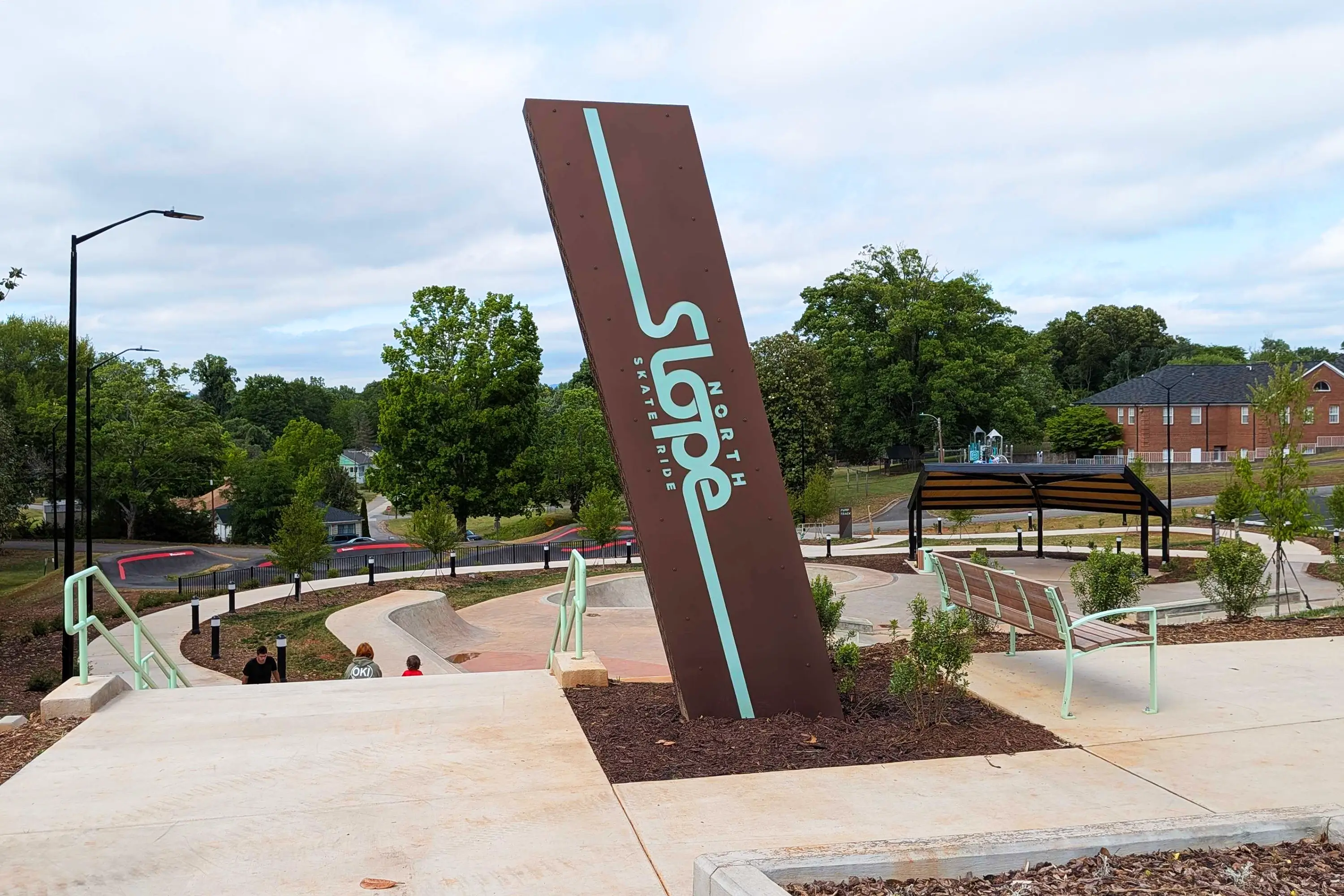 The entrance monument to Spindale Skate Park, with the rest of the park in the background
