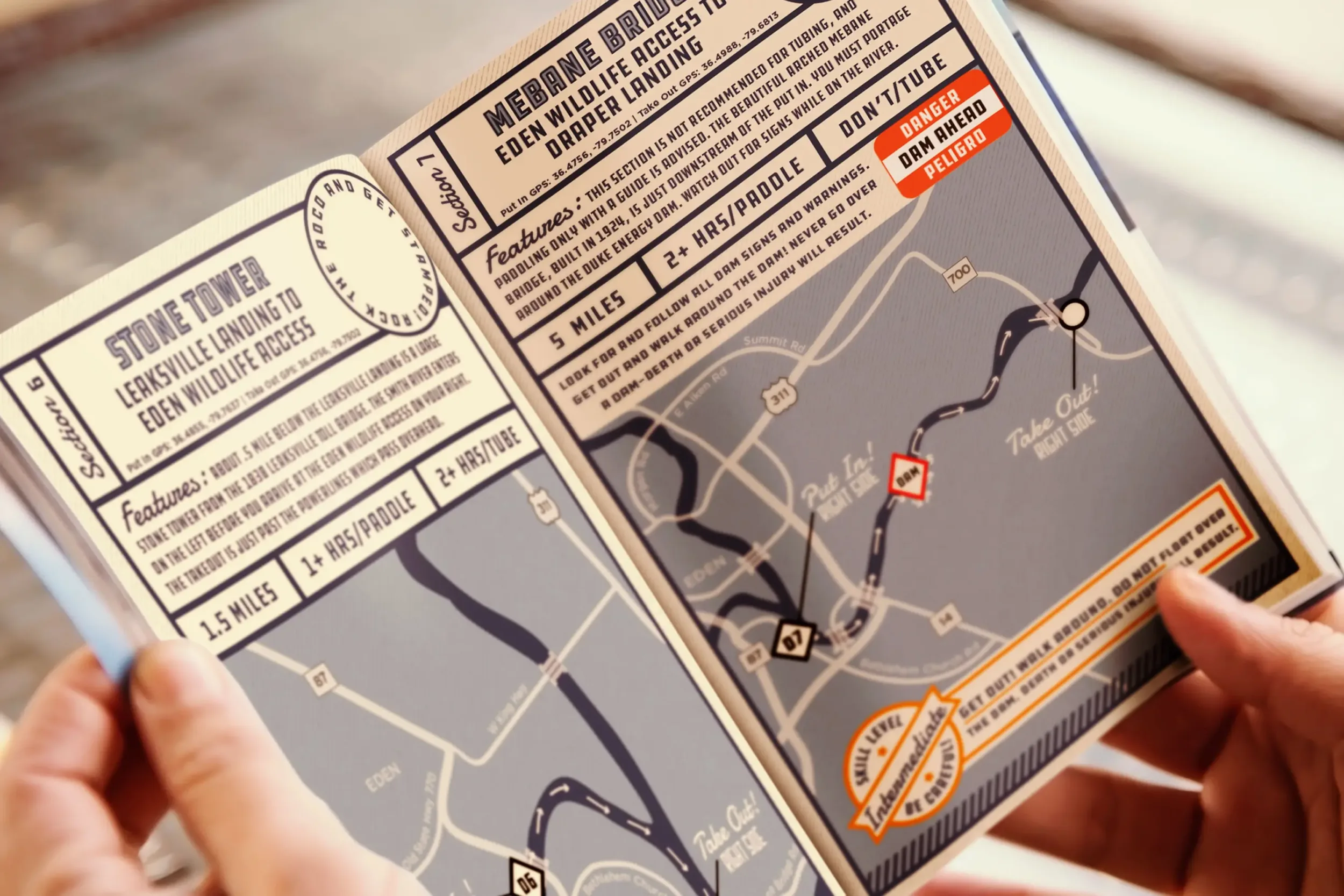 A person holding the RoCo Blueway Guide