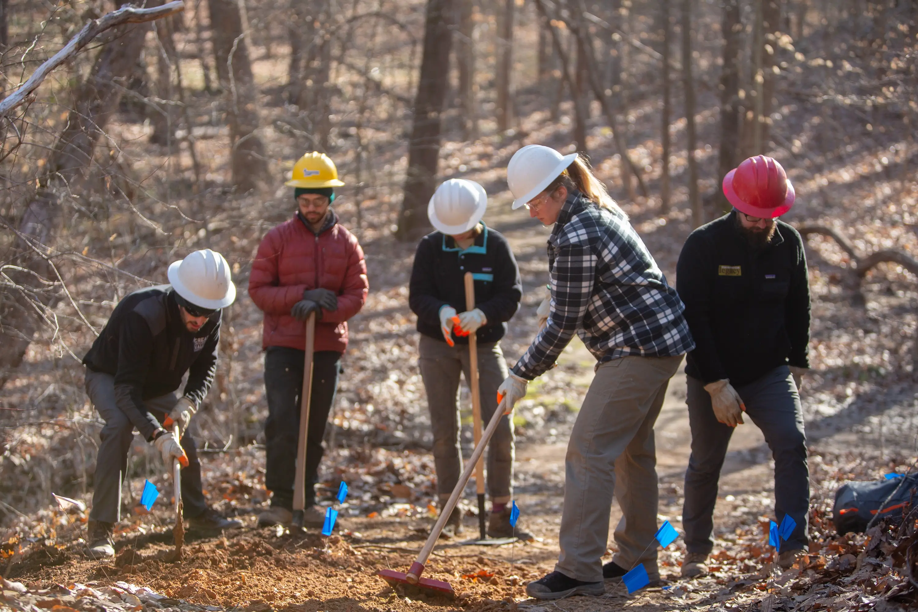 College students working on a trail at a workshop.