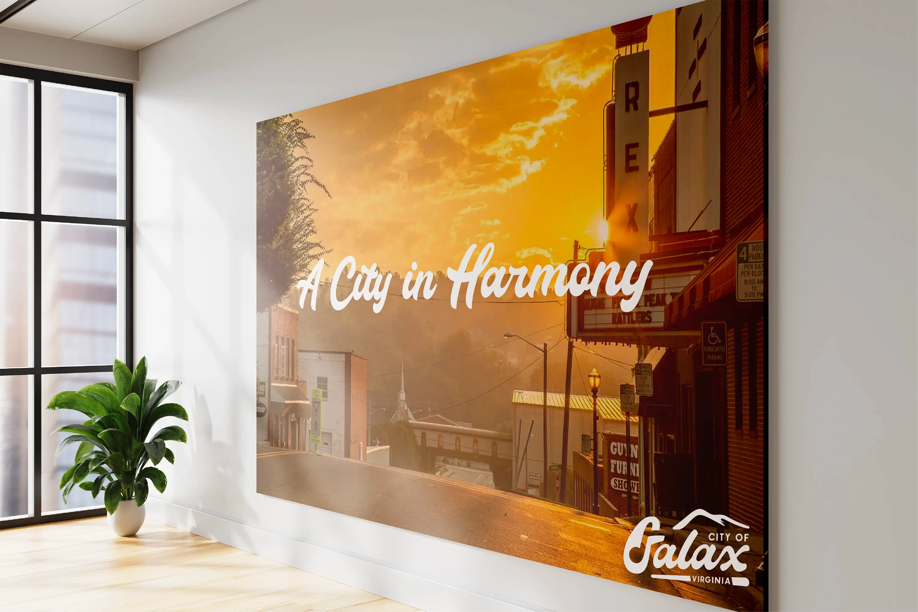 A canvas print of the City of Galax brand overlaid on a photo of the Rex Theater