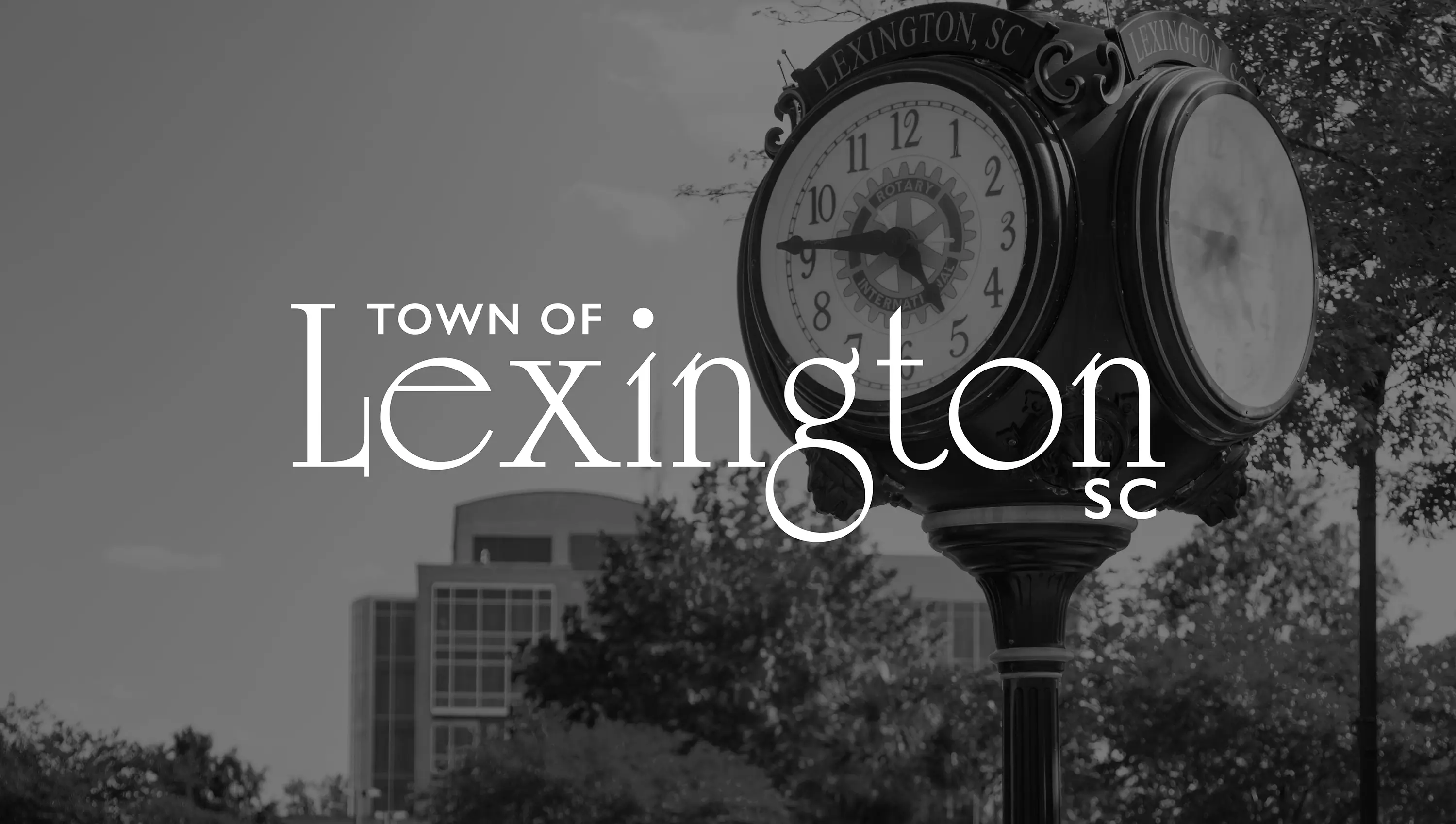The Town of Lexington, SC logo overlaid on a photo of a rotary clock