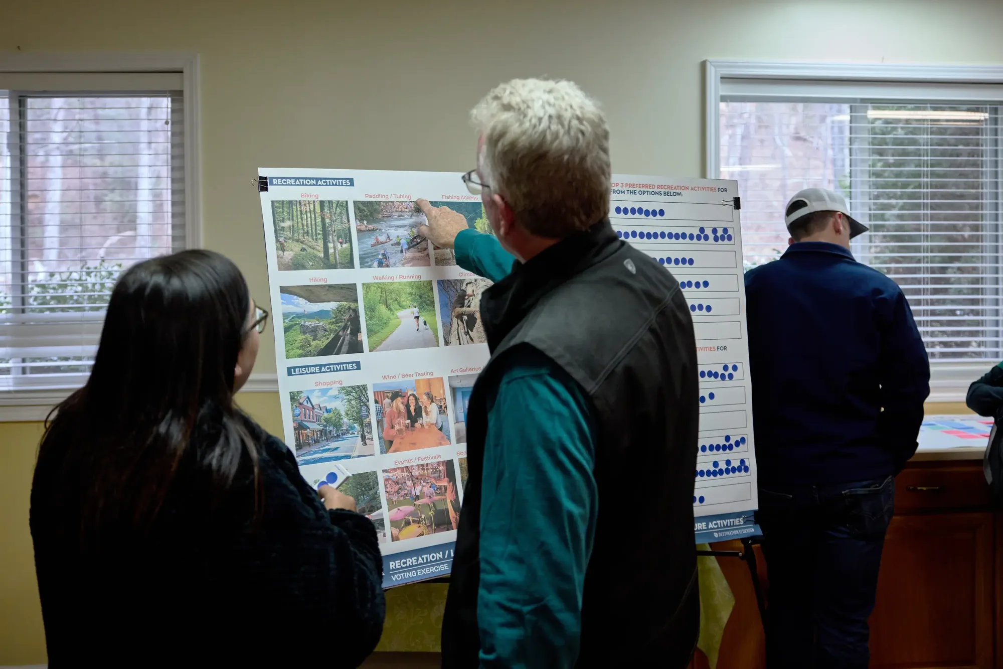 A man pointing at paddling / tubing in the recreation opportunities category