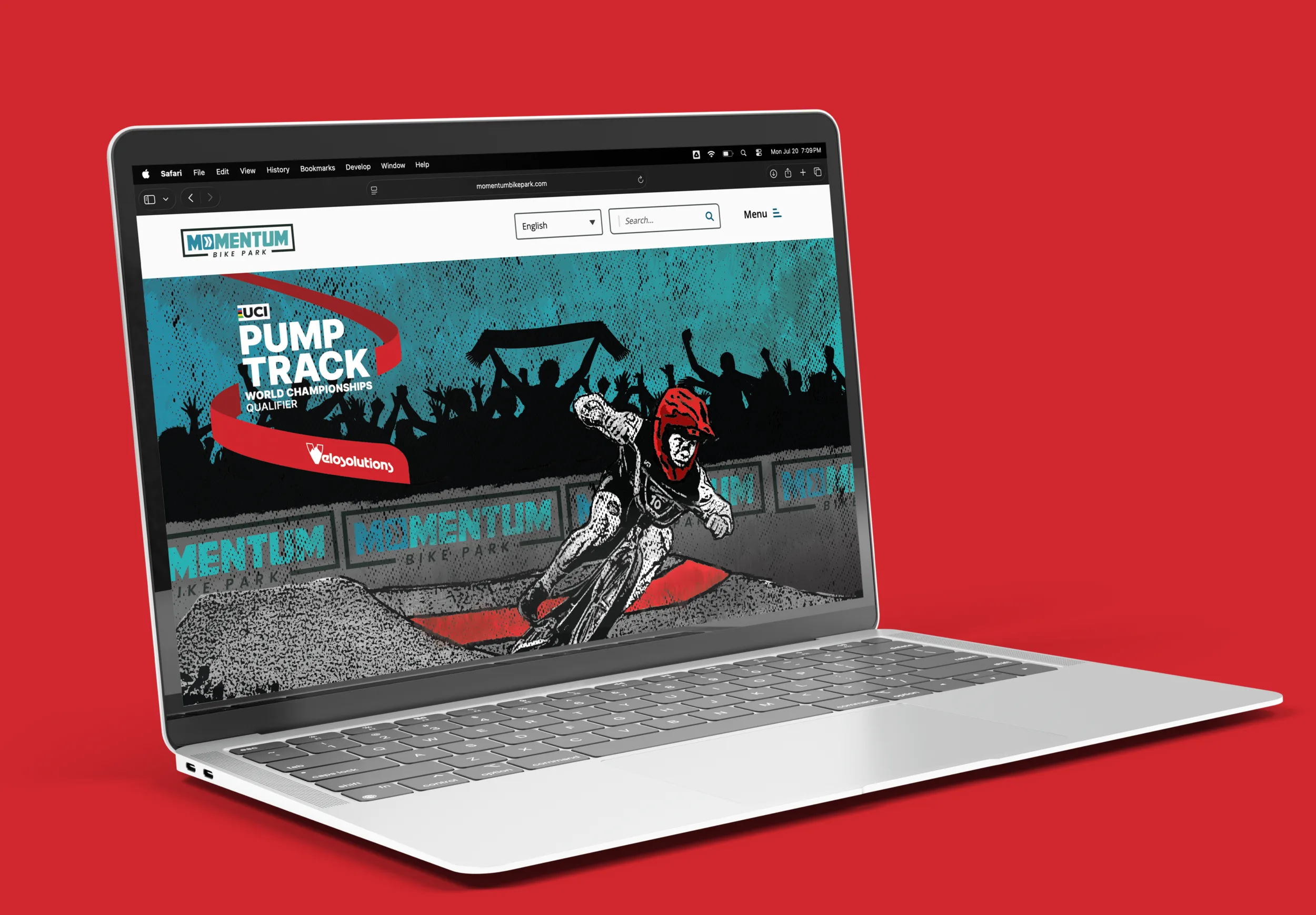 Momentum Bike Park website shown on a laptop, with a UCI Pump Track World Championships qualifier banner