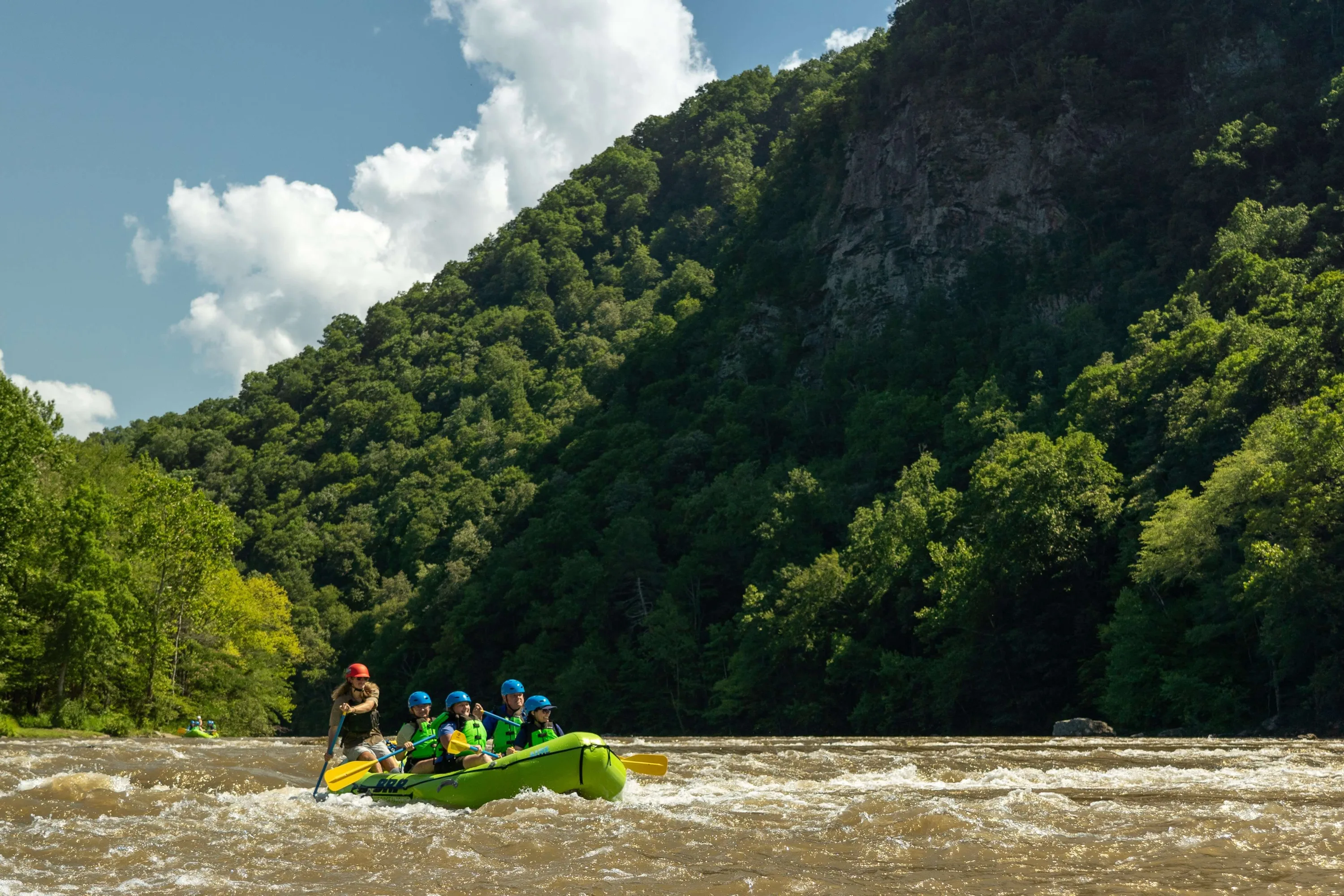 People on a raft going down the river