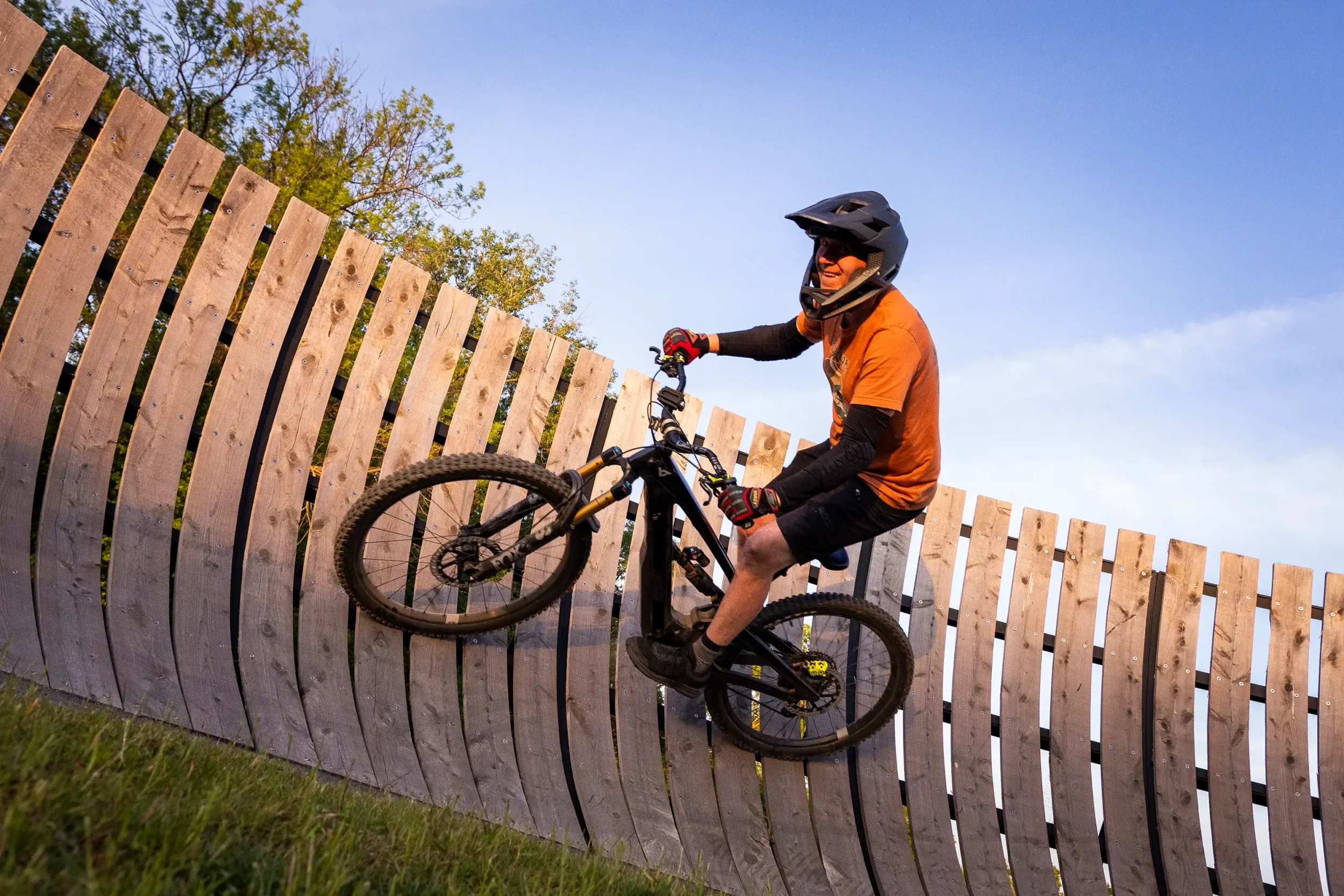 A man riding a slanted ramp