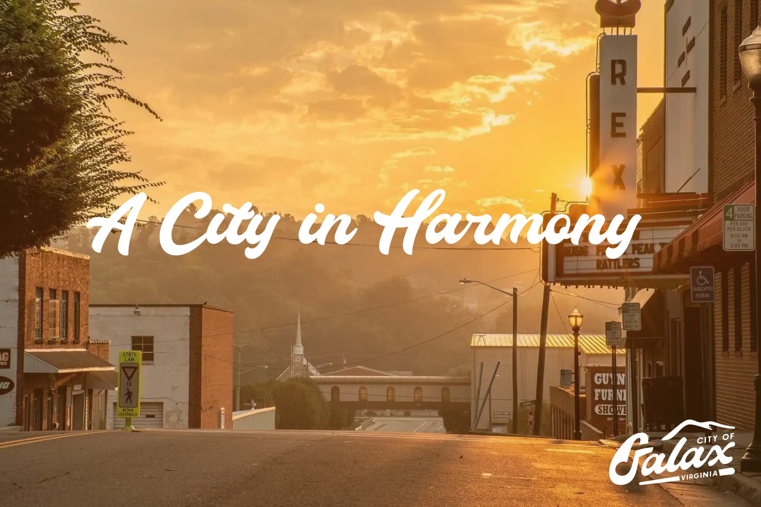 The City of Galax tagline overlaid on a sunset photo at Rex Theatre