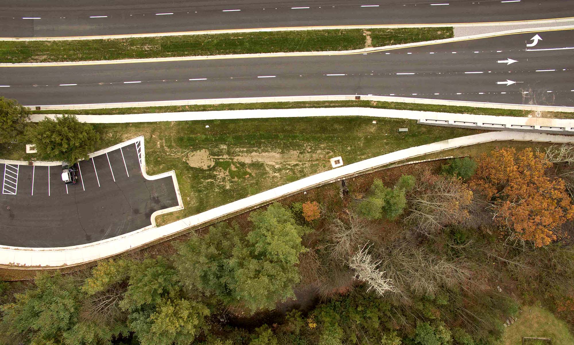 Middle fork greenway drone photo showing highway, parking lot, forest, and river.