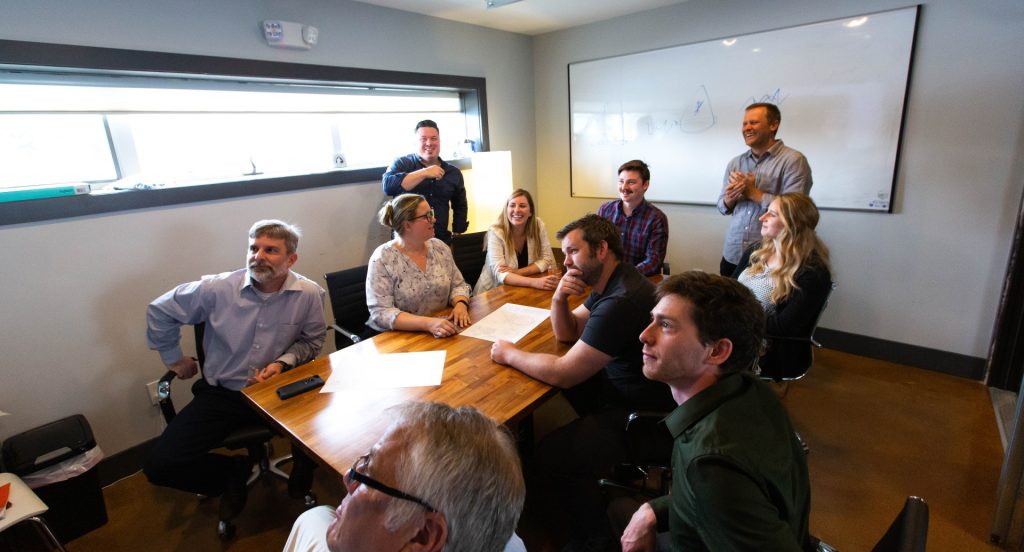 The Destination by Design team in a conference room